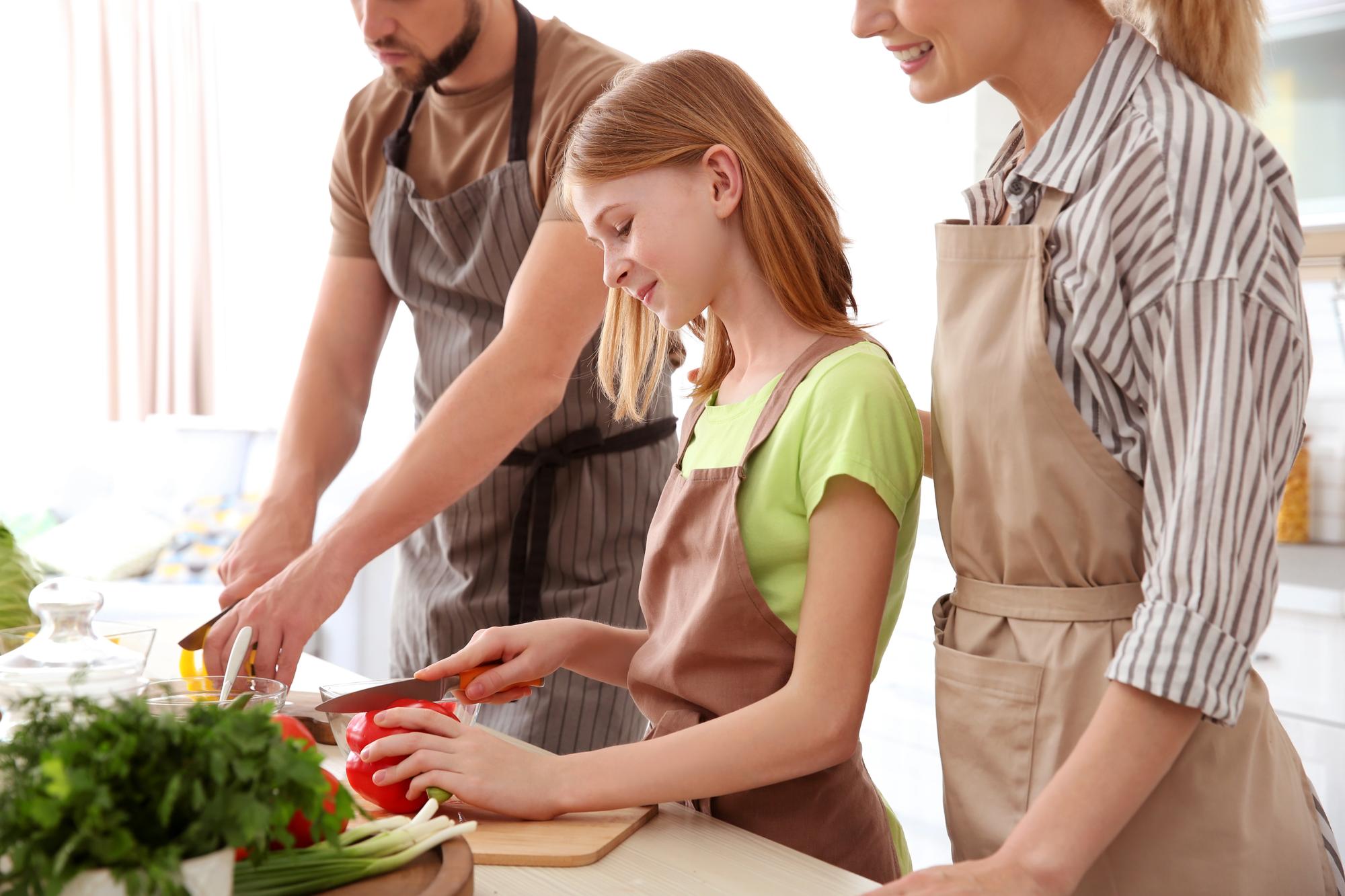 Students chopping vegetables in a circle